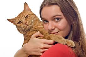 Teen holding her pet cat stock image. Image of teenager
