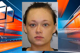 Woman charged with theft