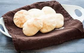 This easy homemade pita bread recipe made on the stove top with soft and chewy texture puffed like a balloon creating a pocket that is great for fillings when stuffed with veggies and hummus makes a perfect healthy dinner. Easy Pita Bread Recipe Little House Big Alaska