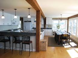 A welcoming dining setting invites you to pause and cherish these moments together. The Maine Boathouse Cottages