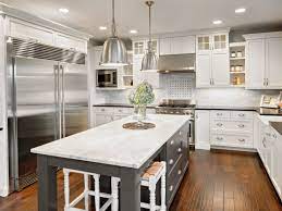 Gray brushed limestone kitchen floor tiles for modern kitchen flooring idea combined with white kitchen island and small wooden chairs to look bright in the kitchen. 7 Durable Options For Kitchen Flooring
