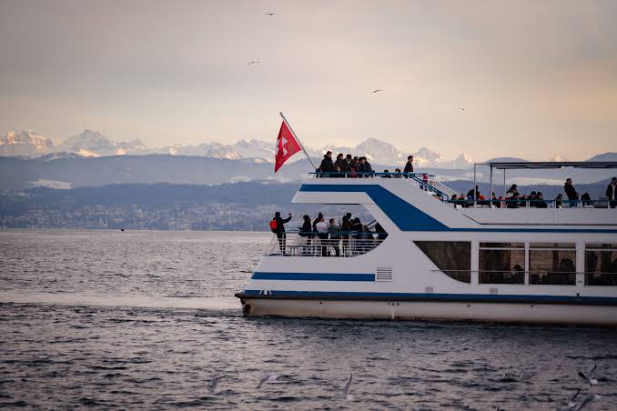 Scenic Boat Ride on Lake Zurich at Dusk · Free Stock Photo