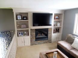 Another popular built in bookshelf custom design includes a dedicated shelf for a television set. Remodelaholic 15 Diy Built In Shelving Ideas
