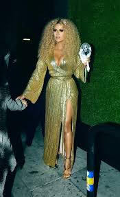 Khloe kardashian flaunts her bum in skintight black dress after sister kim tells her to lose weight. Khloe Kardashian Channels Diana Ross In A Gold Dress Sandals Curls Footwear News