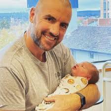 Former Block contestant and AFL player Darren Jolly celebrates the birth of  new baby with partner Lucy Porter