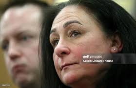 Laura O'Leary, sister of victim William George Bundy, stands next to...  News Photo