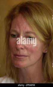 Beth Holloway Twitty, mother of missing teen Natalee Holloway, pauses  during an interview with the Associated Press as her husband Jug Twitty  looks