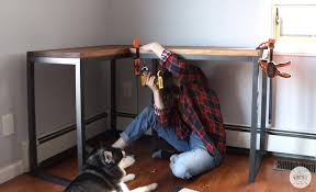 And the legs are made from stair spindles… how clever! Diy Corner Desk For Under 150 Diy Huntress