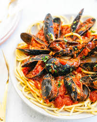 How do you steam mussels in tomato sauce? Easy Mussels Marinara A Couple Cooks