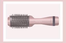 The handle is ergonomic, so you can dry your hair without irritating your wrist. This Blow Drying Hair Brush Is The Game Changing Hair Tool You Ve Been Waiting For