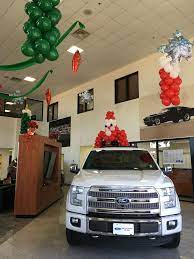 When decorating for your christmas party, you don't have to sacrifice style. Car Dealership Decorated For Christmas Christmas Decorations Balloons Xmas Holidays