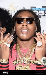 Mitglied der Rap-Gruppe Migos, Takeoff (Kirshnik Ball in pink) besucht am  30. Oktober 2014 das