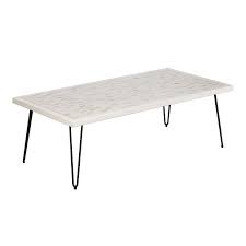 An upholstered ottoman can serve as a coffee table and bring a cozy touch to a room, while a sleek marble coffee table adds instant elegance and sophistication. Woodbrick White Hairpin Black Coffee Table