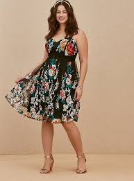 The dress is made of leather. Plus Size Special Occasion Black Floral Embroidered Mesh Dress Torrid