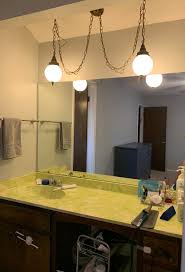 Some of our lighting companies offer sloped ceiling canopies and adapters for pendants and chandeliers. Need Bathroom Light Fixture Help For Sloped Ceiling Homedecorating