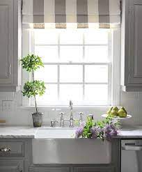 A Roman Shade Over A Kitchen Sink Window Offers A Great Touch Of Softness To All The Hard Su Kitchen Window Treatments Kitchen Sink Window Kitchen Sink Remodel