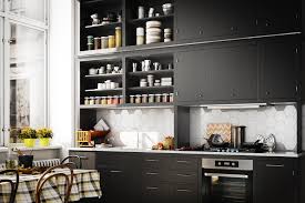 Mask off the interiors with painters' tape for a clean finish and sand only the front surfaces and visible edges of the cabinet face. How To Paint Kitchen Cabinets In 8 Simple Steps Architectural Digest