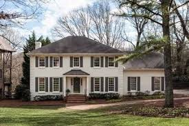 Original red brick colonial was restored and new additions were constructed on the sides of the house. Painted Brick House Monterey White Painted Brick House Colonial House Exteriors White Brick Houses