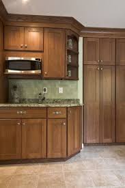 Chestnut Cabinets With Light Colored Tile Floors Definitely A Different Backsplash Tho Chestnut Kitchen Cabinets Kitchen Wall Colors Kitchen Dining Room Combo