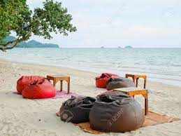 Browse the user profile and get inspired. Bean Bags And Tables Set On The Beach Stock Photo Picture And Royalty Free Image Image 64166149