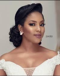 Wedding updo hairstyles for black women go well with natural textured curls and waves. Low Classic Updo For Formal Events Avedaibw Bridal Hair And Makeup African Wedding Hairstyles Black Wedding Hairstyles