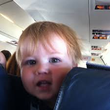 Little guy in seat in front of us