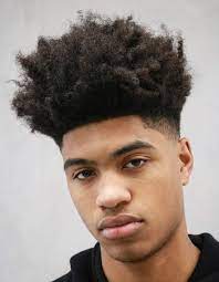 The mohawk style is appropriate for work or play. 20 Iconic Haircuts For Black Men