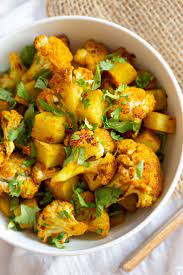 Baked Aloo Gobi Vegan Recipe Indian Spiced Potato Cauliflower Vegan Richa Recipe Aloo Gobi Vegan Recipes Indian Food Recipes