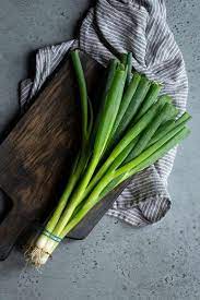 Green onions bunch on a white background. Scallion Vs Green Onions Vs Spring Onions Savory Simple