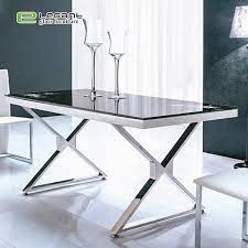 Dining set including marble, wooden and round tables are available in our store. China Black Painted Tempered Glass Top Restaurant Dining Table With X Shape Stainless Steel Table Leg China Glass Dining Table Furniture
