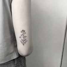Minimalist Dry Flowers On The Back Of The Right Arm Tattoo Back Of Arm Tattoos Elbow Tattoos