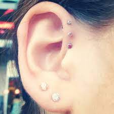 Pin By Rena On Some Piercings Triple Helix Piercing Helix Piercing Cartilage Piercing