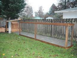 Dog Run Putting Up The Fence Dog Run Fence Diy Dog Run Cheap Dog Kennels