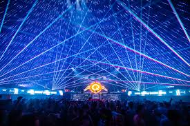 She is standing on a large balcony area with one almost unused, stairway visible in the distance by. Q Dance Q Dance At Tomorrowland Weekend 1 2019