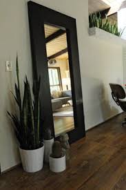 In this article, we will share 12 bedroom mirror design ideas that are not only attractive, but can also enhance the look of your bedroom so that it makes it look more. Leaning Pictures And Mirrors