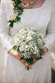 Lovely Bridal Bouquet Comprised Of White Gypsophila White Yellow Asters Green Foliage Gypsophila Wedding White Wedding Flowers Wedding