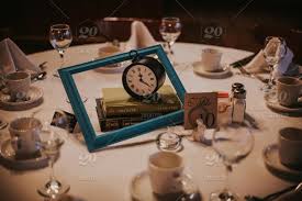A table clock placed on your desk or an alarm clock on your nightstand are calm, simple a table clock can also be a distinctive design piece that makes a perfect gift for someone close to you. High Resolution Digital Close Up Photograph Of Fun Tea Party Alice In Wonderland Themed Table Centerpiece Decorations At A Wedding By Dorey Kronick Stock Photo 6164dbd5 E0d9 4091 8b0e 6361b4f6ea62