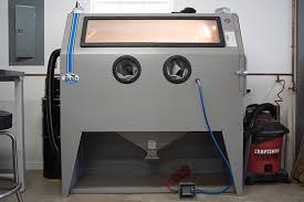Homemade sandblasting cabinet capable of functioning as either a siphon feed system or a pressure pot blaster. A Real Blast Cabinet The Garage Journal The Garage Journal