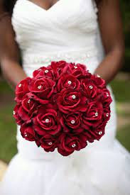This wedding flower package can be part of your destination wedding day! Red Roses With Diamond Studs Poked Through Super Elegant Red Bouquet Wedding Rose Bridal Bouquet Red Rose Wedding