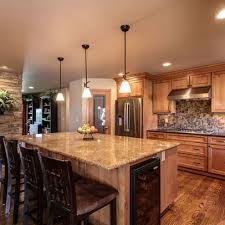 Light Knotty Alder Cabinets With Granite Countertop Google Search Fireplace Remodel Kitchen Fireplace Kitchen Design