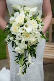 Nikki carried a small bunch of white calla lilies for her bouquet. Kendalls Wedding Flowers At Brocket Hall Golf Club Kendalls Florist