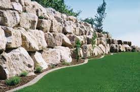 A weather beaten old ruin rock wall building and wooden door. St George Rock Walls Rock Retaining Walls In St George