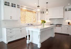 White Kitchen With Stacked Upper Cabinet And Shaker Style Doors Featured In New England Hom White Shaker Kitchen Kitchen Cabinets Height Gorgeous White Kitchen