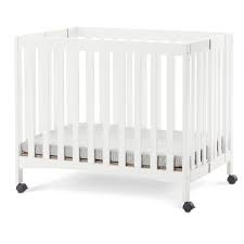 The Trendy European Style Of The Forever Eclectic London Mini Folding Crib Features Smooth Clean Lines With Soft Arched Details In 2020 Portable Crib Cribs Mini Crib