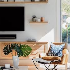 Rh's distressed pine shelf:nature and nurture contributed to the textured beauty of our wall shelves, which are handcrafted from substantial planks of pine. Black Wood Tv Cabinet On Shiplap Wall Transitional Living Room