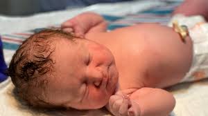 Joyful start to 2021: Grand Rapids parents cuddle new babies