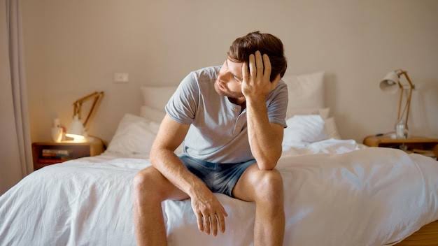 Depression mental health and sad man in stress feeling bad upset and  depressed alone in his