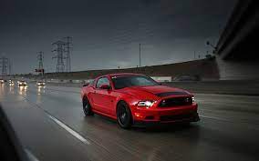 Hd Wallpaper Red Ford Mustang Coupe Parked On Paved Road Near Grass Field At Daytime Wallpaper Flare