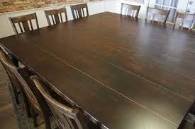 This double extension dining table is a modern solution for small spaces it transforms from a 6 seater table to a 12 seater simply by pulling on one end of the table. 3 Top 12 Seat Dining Table Set For Everyday Use 2021 Reviews