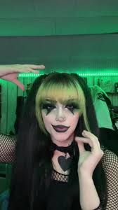 A Clown Singing Boogie Boogie Woo with Pink and Blue Makeup